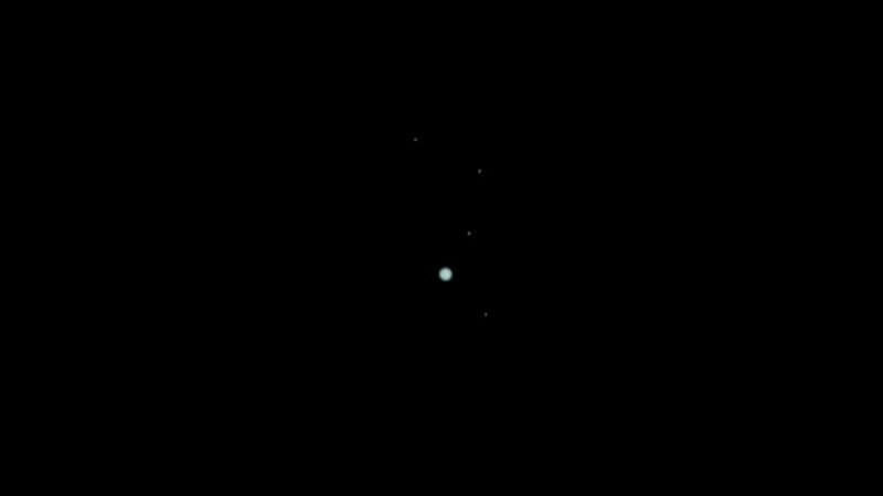 Uranus with its four largest moons photo credit Brandon Ghany Flickr
