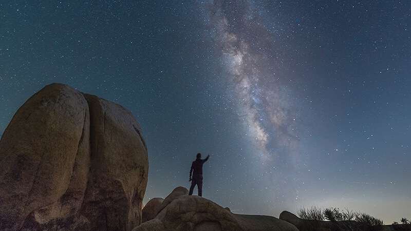 Pointing to the Milky Way at Joshua Tree